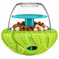 Green and clear dog toy with food compartments on a white background